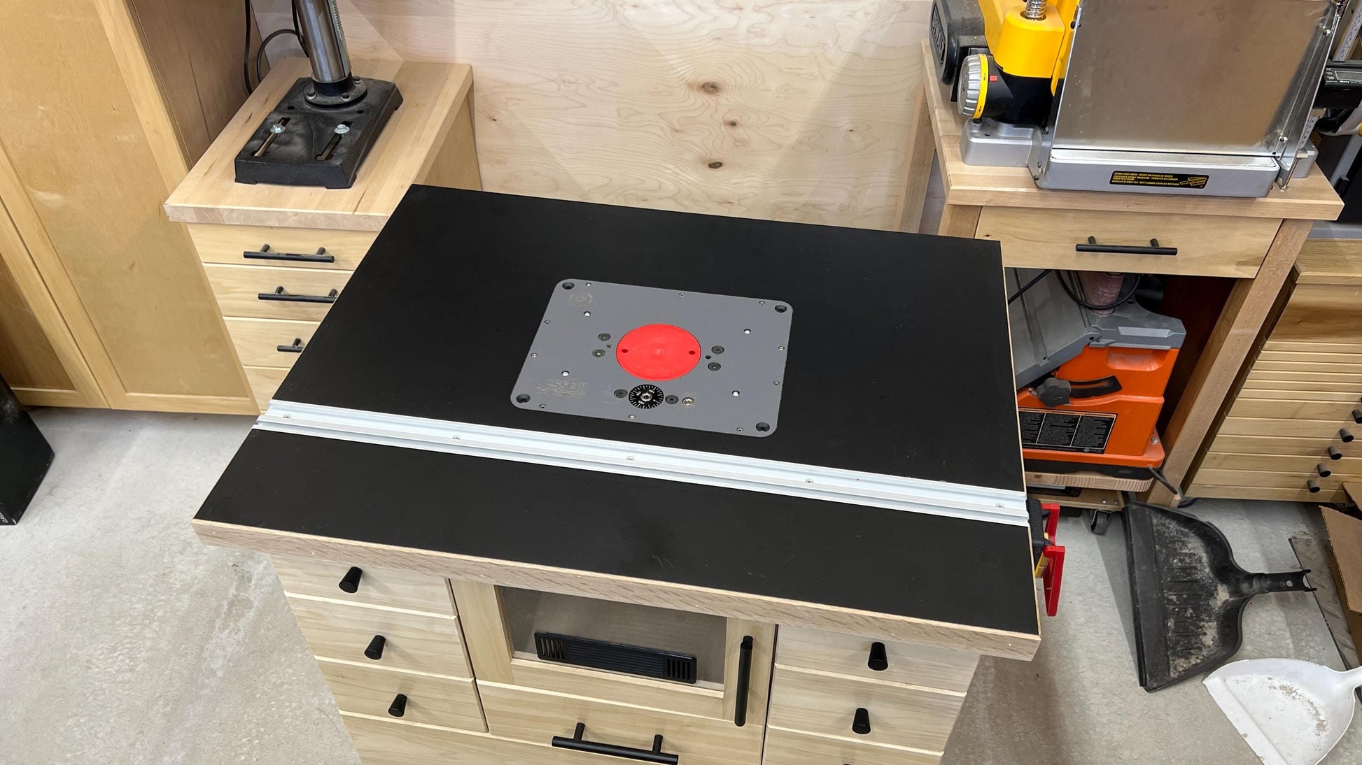 router table with miter channel, power feeder, LED lighting, and 3D-printed templates installed